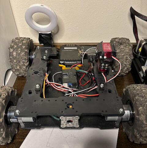 May 2023, Started Field testing the first prototype, and issues quickly arose; the clearance was high due to the tan-pilt mechanism, and the rover would get high-centered on everything.
